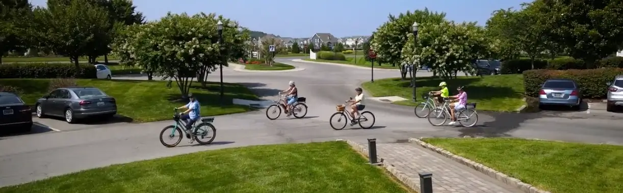 Seniors riding bicycles in group