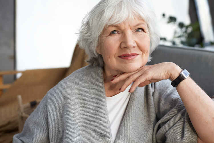 Senior woman relaxing at home.