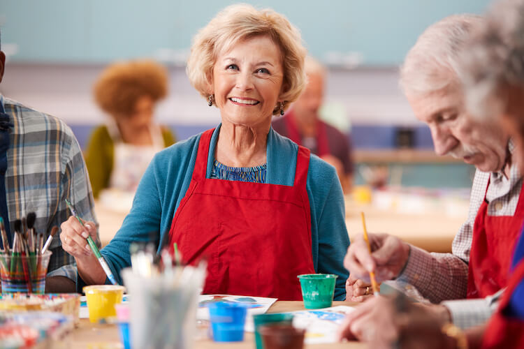 Senior woman attending an art class.