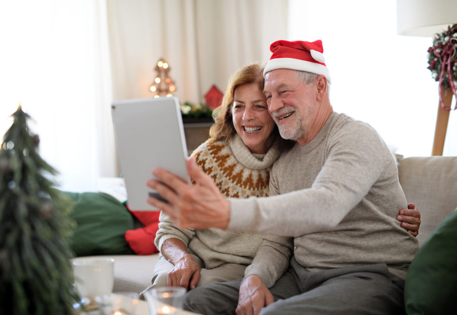 Seniors having a video chat with family to celebrate the holiday season.