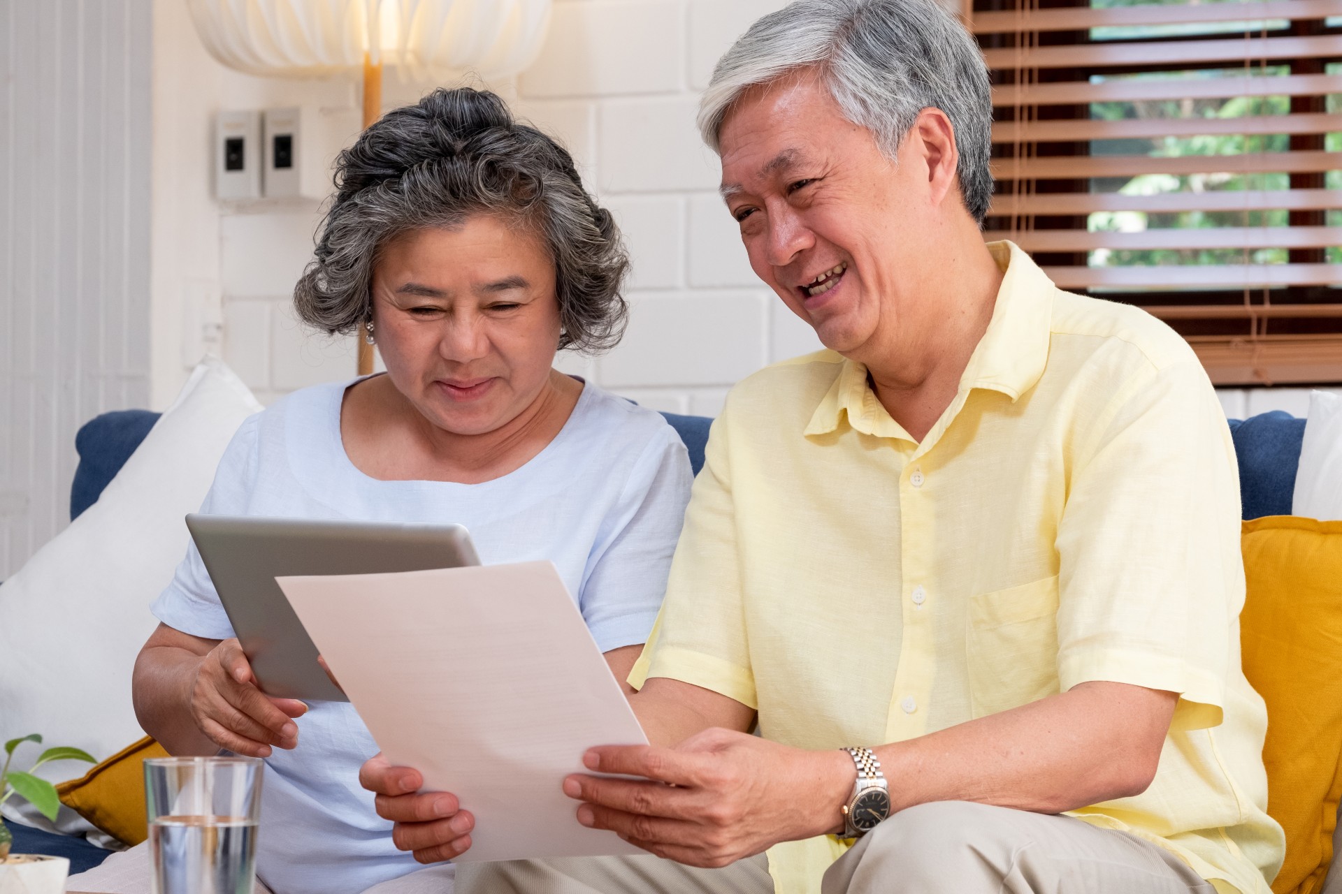 Senior couple looking at a retirement document.
