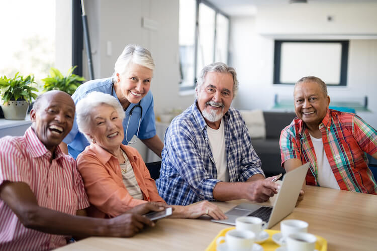 Smiling residents of a senior living community.