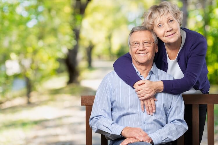 Senior couple seated in a park