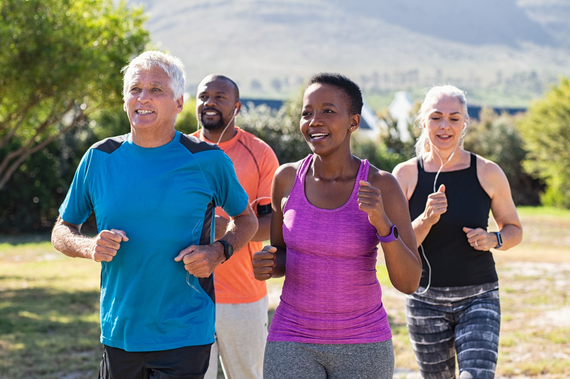 Elderly group exercising outside.