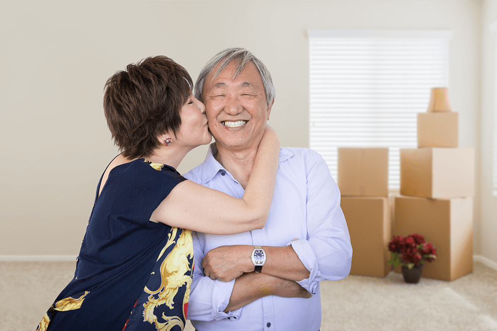 Happy couple moving in