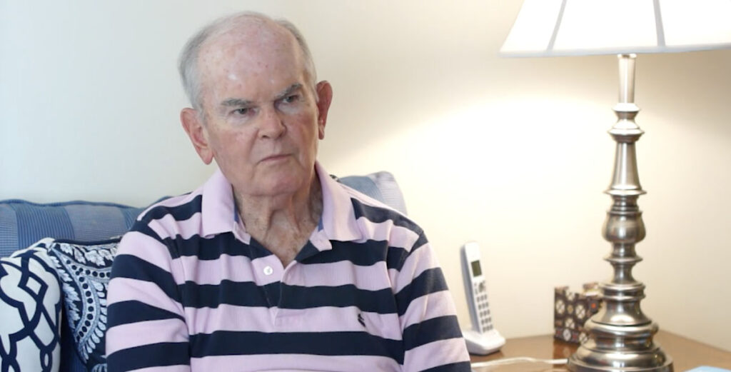 Senior man in striped shirt