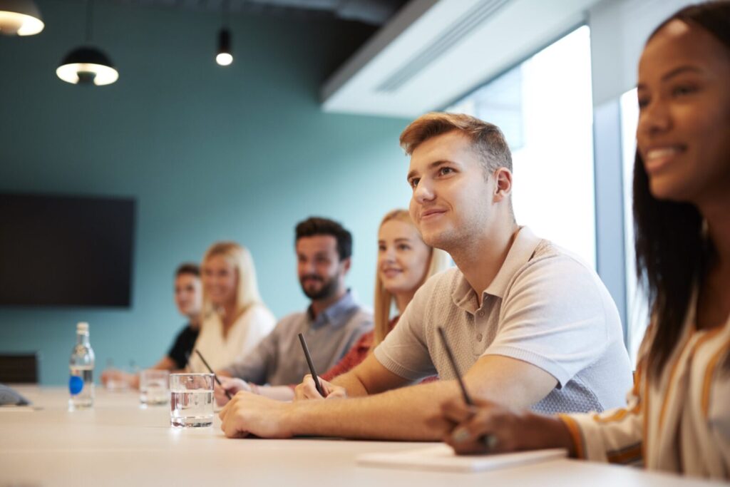 Students at a conference table