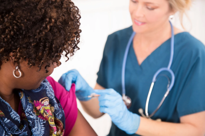 Woman receiving a flue shot