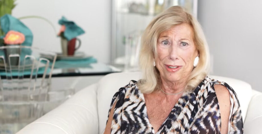 Woman in animal print talking about how to be happy