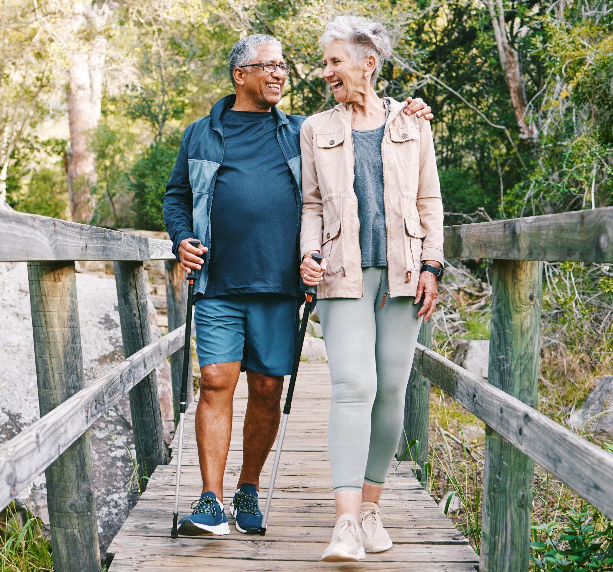 Seniors walking down a bridge