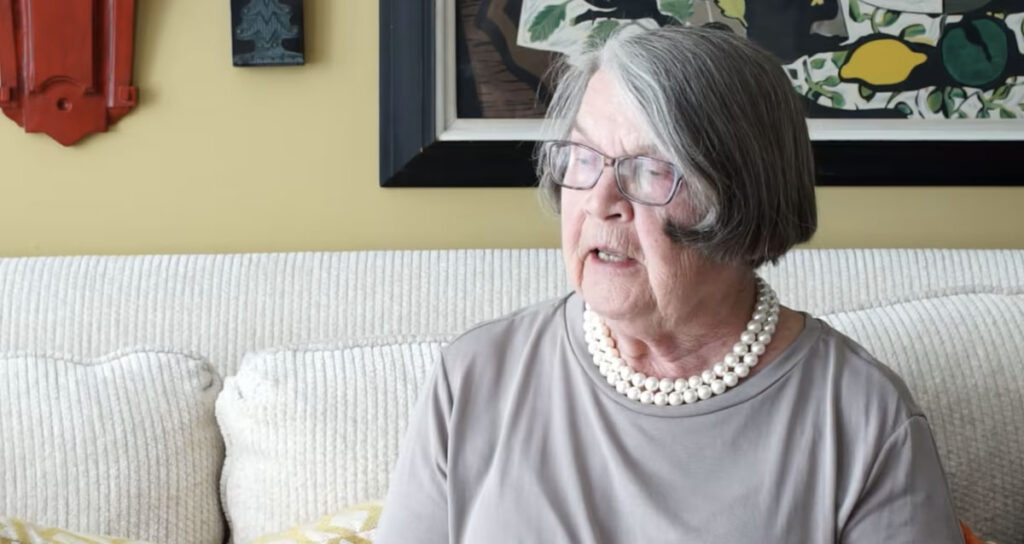 woman in gray talking about not raking leaves