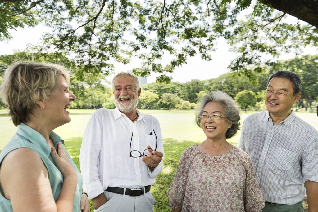 Seniors having fun laughing in a park