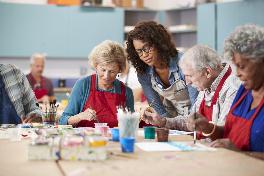Seniors doing art with instructor