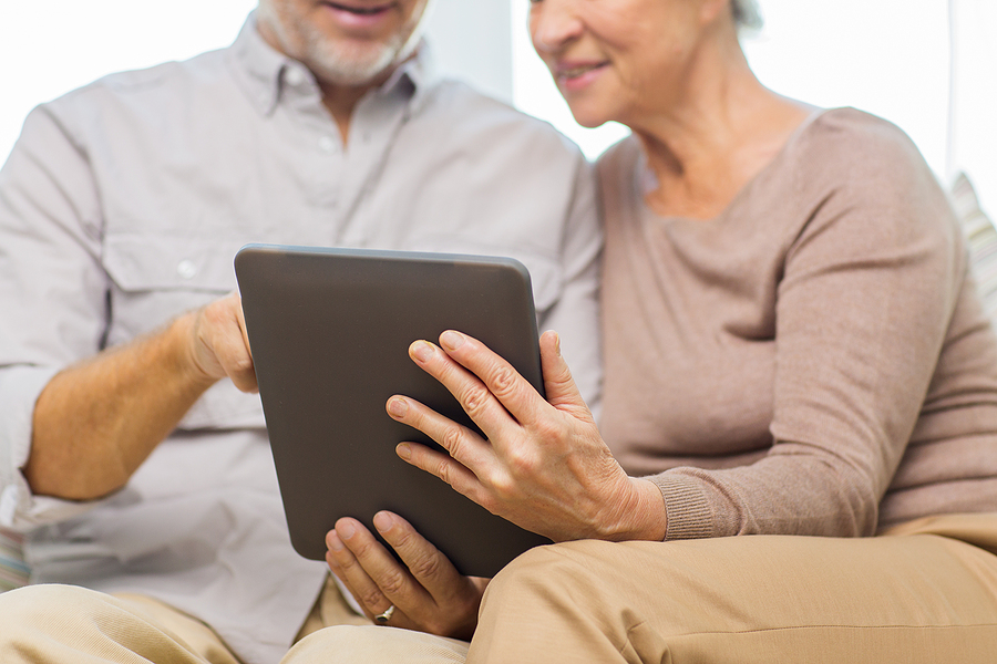 Senior Couple on IPad together.