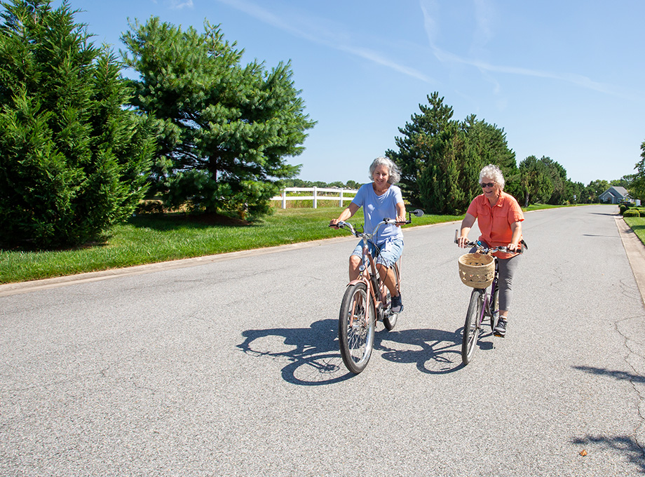 Senior women riding bicycles together