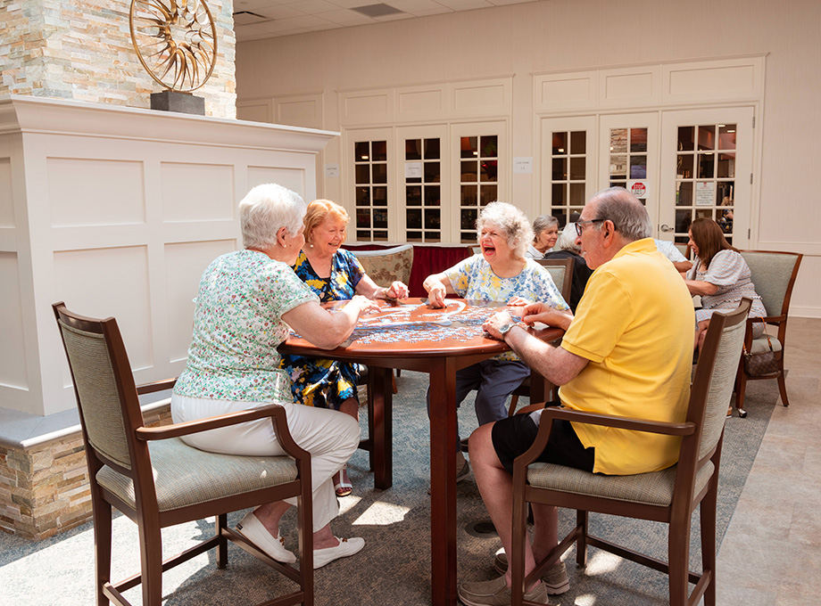 Group of seniors putting together puzzle