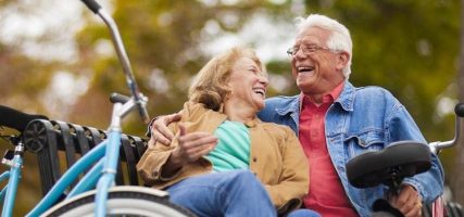 Two seniors sitting on bench