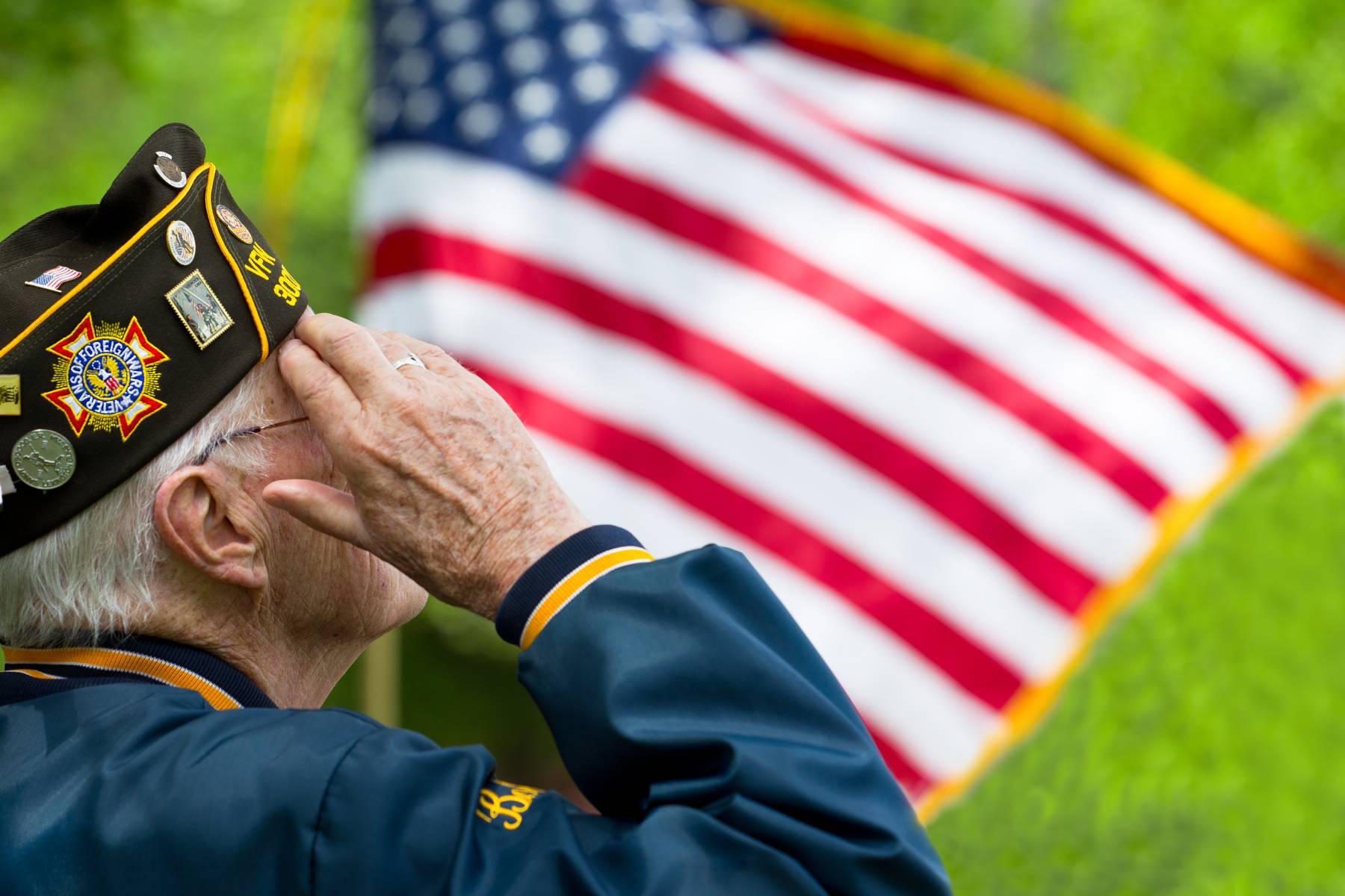 veteran saluting the American flag