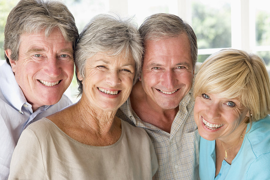 Group of older adults laughing and smiling together